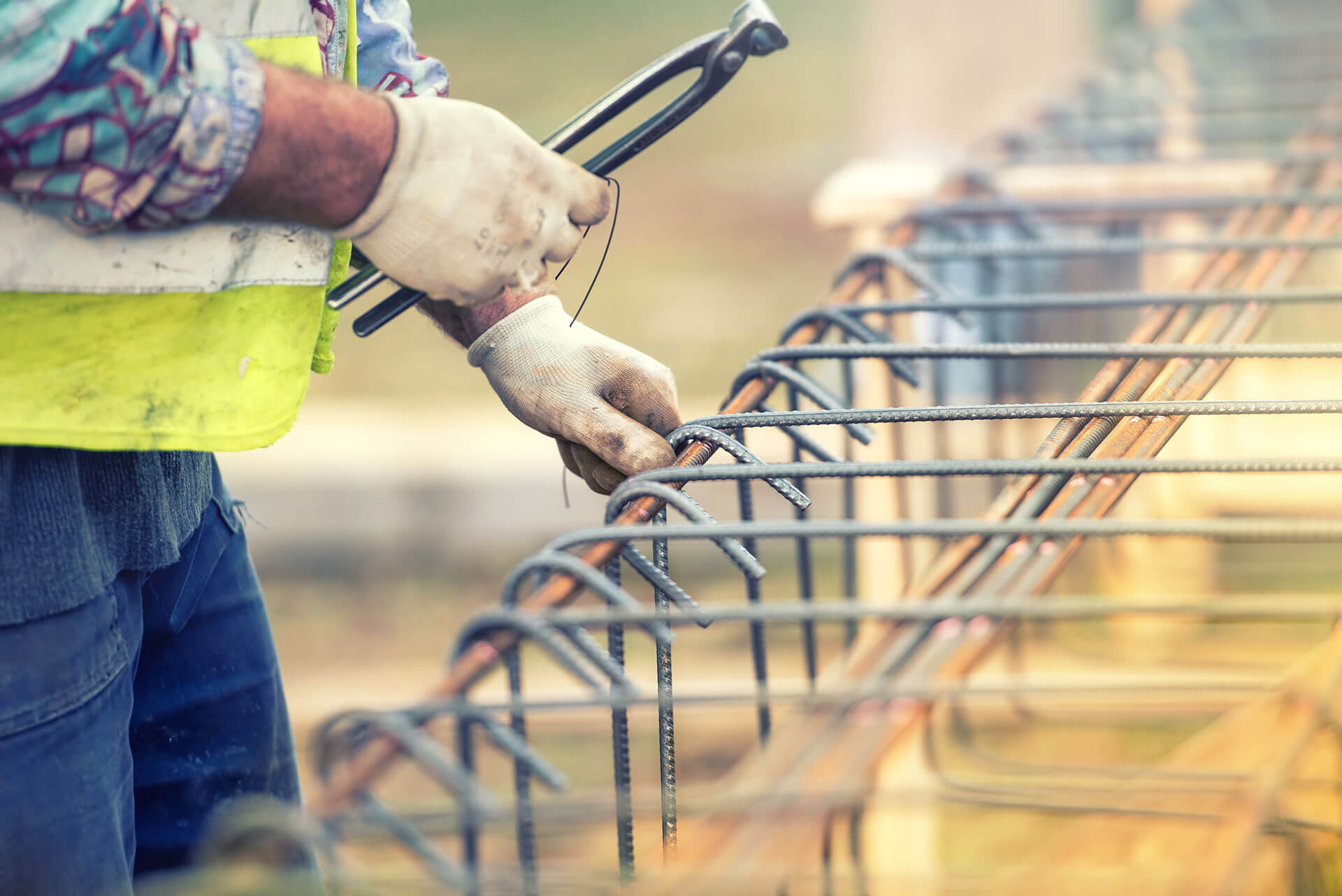 worker-hands-using-steel-wire-and-pliers-to-secure-2021-04-02-18-45-58-utc (1)